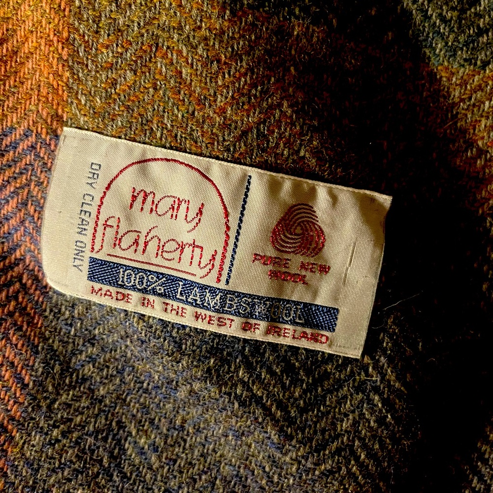 This is a hand woven, virgin lambswool, designer. scarf